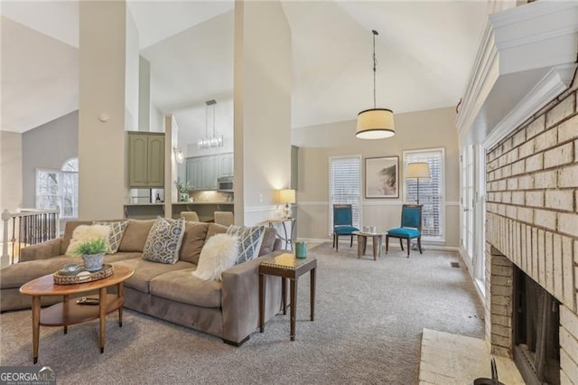 living room with light carpet, a fireplace, and high vaulted ceiling