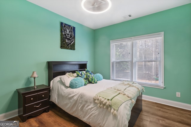 bedroom featuring dark hardwood / wood-style flooring