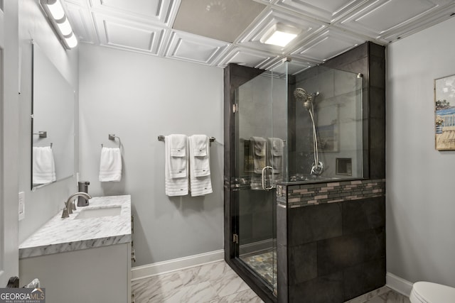 bathroom featuring an enclosed shower, vanity, and toilet