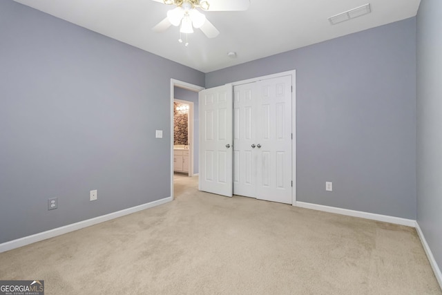 480 Glenns Farm Way, Grayson, GA 30017 - unfurnished bedroom featuring light carpet, baseboards, a closet, and ceiling fan