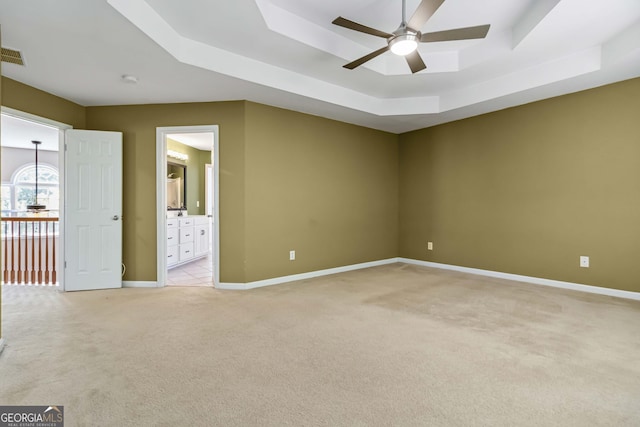 480 Glenns Farm Way, Grayson, GA 30017 - spare room with a raised ceiling, light carpet, a ceiling fan, and baseboards