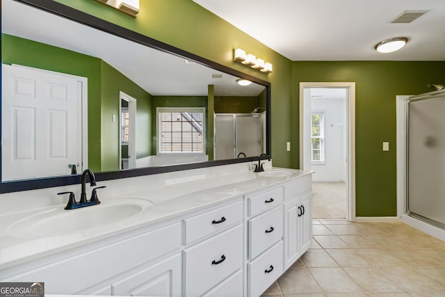 480 Glenns Farm Way, Grayson, GA 30017 - full bathroom featuring a shower stall, double vanity, tile patterned flooring, and plenty of natural light