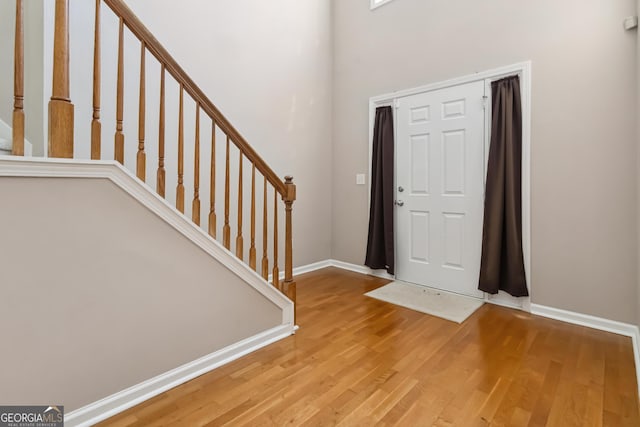 480 Glenns Farm Way, Grayson, GA 30017 - entrance foyer with wood finished floors, stairs, and baseboards
