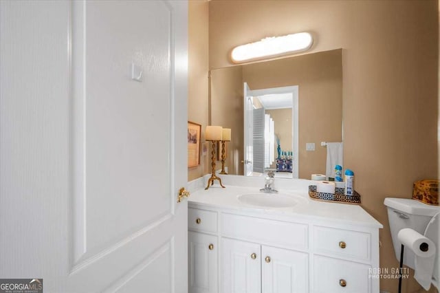 bathroom with vanity and toilet