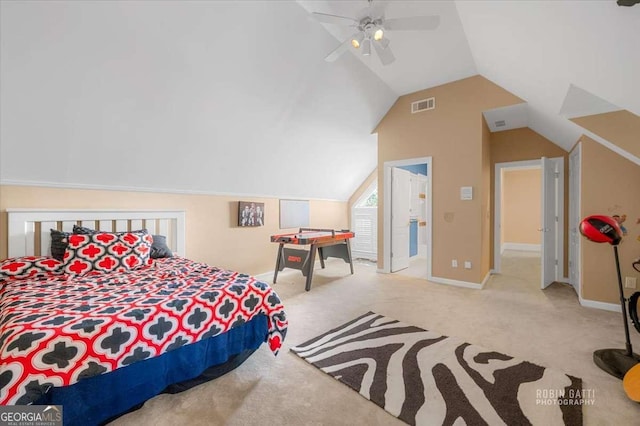 carpeted bedroom featuring lofted ceiling and ceiling fan