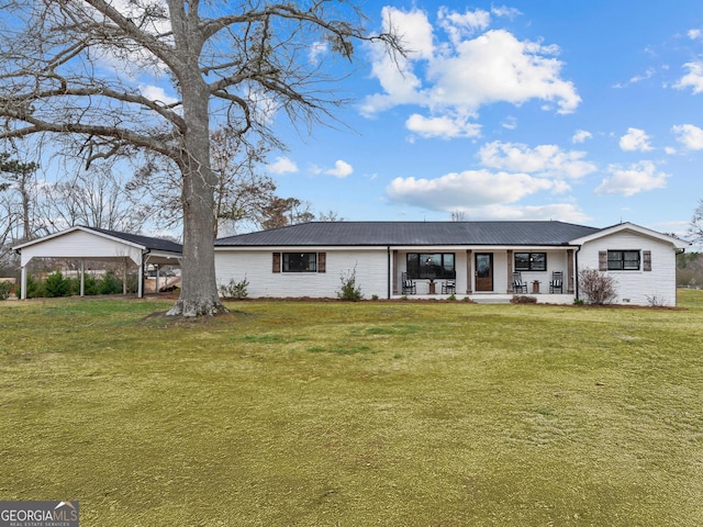 ranch-style home with a front lawn, a carport, and a porch