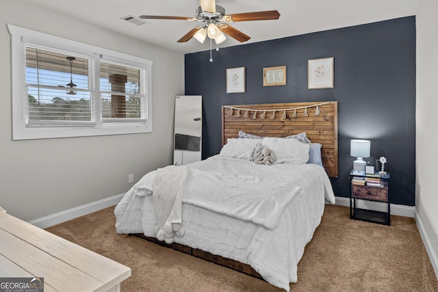 carpeted bedroom featuring ceiling fan