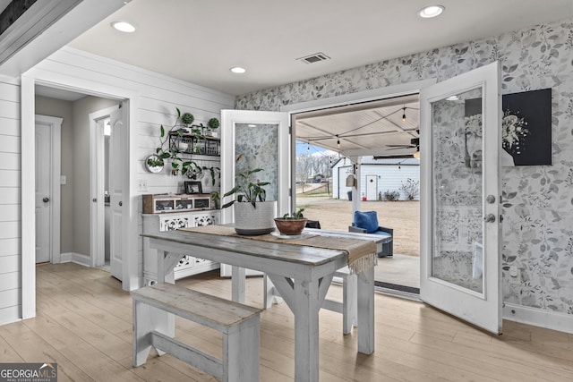 dining space featuring ceiling fan and wood-type flooring