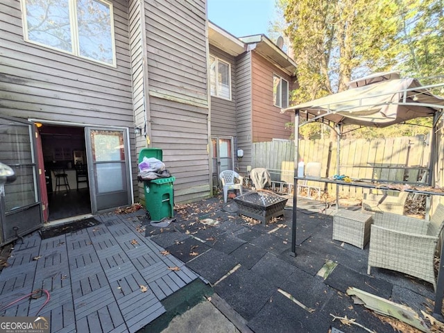 view of patio featuring an outdoor living space with a fire pit