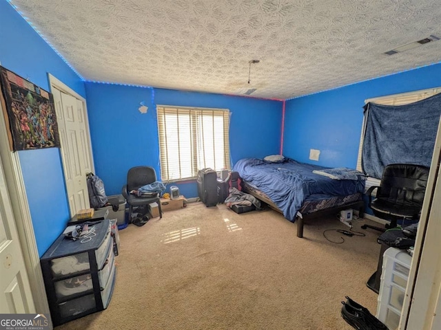 unfurnished bedroom featuring a closet, a textured ceiling, and carpet flooring