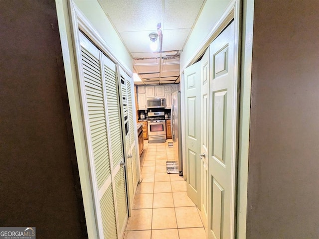 hall with light tile patterned flooring