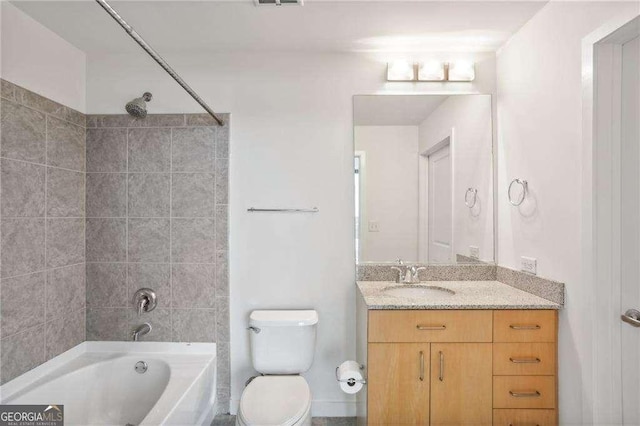 bathroom with visible vents, toilet, vanity, and  shower combination