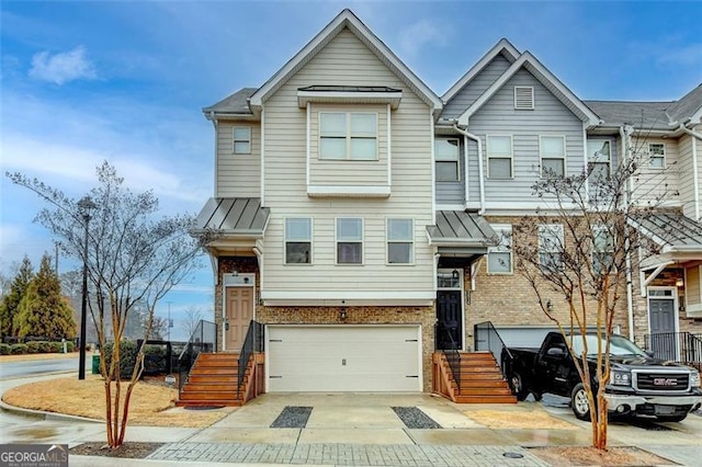 multi unit property featuring a garage