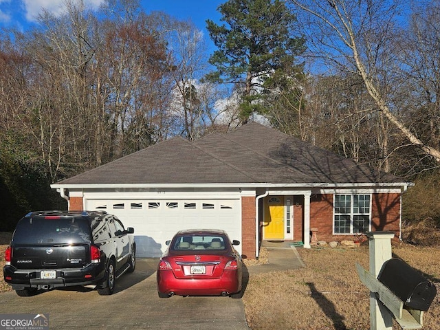 ranch-style home featuring a garage