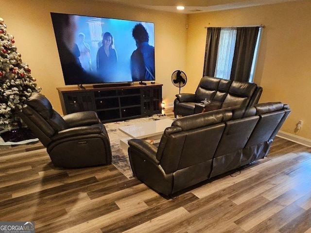 home theater room featuring hardwood / wood-style flooring