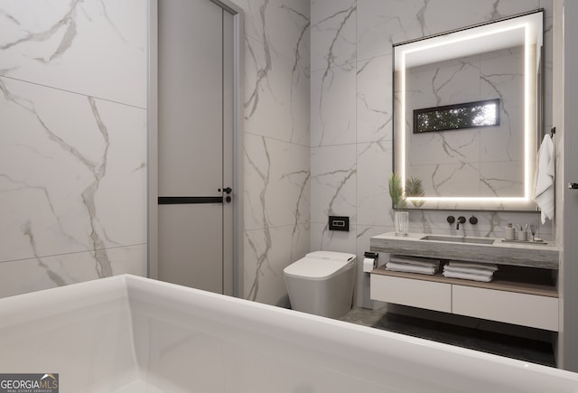 bathroom with vanity, tile walls, and toilet