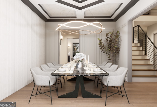 dining space featuring an inviting chandelier and light hardwood / wood-style flooring