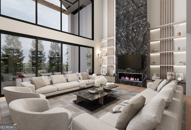 living room with a premium fireplace and hardwood / wood-style floors