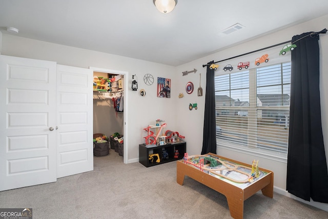 game room featuring light colored carpet, visible vents, and baseboards