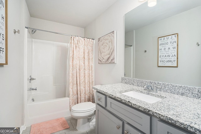 bathroom with shower / bath combo with shower curtain, tile patterned floors, vanity, and toilet