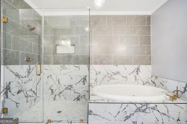 bathroom featuring a garden tub, crown molding, and a shower stall