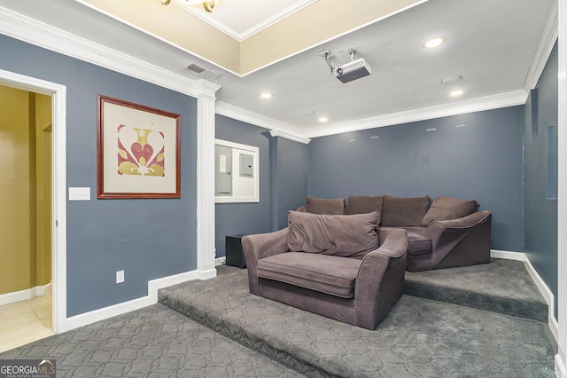 home theater with crown molding, baseboards, visible vents, and ornate columns