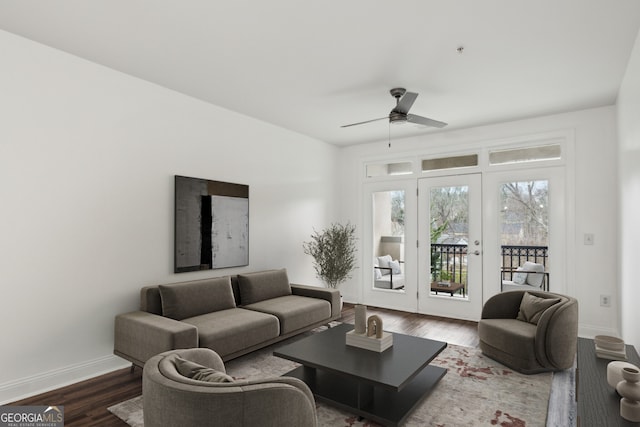 living room with dark hardwood / wood-style floors and ceiling fan