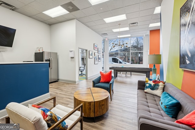 840 United Ave SE Unit 411, Atlanta, GA 30312 - living room with a drop ceiling and light hardwood / wood-style flooring