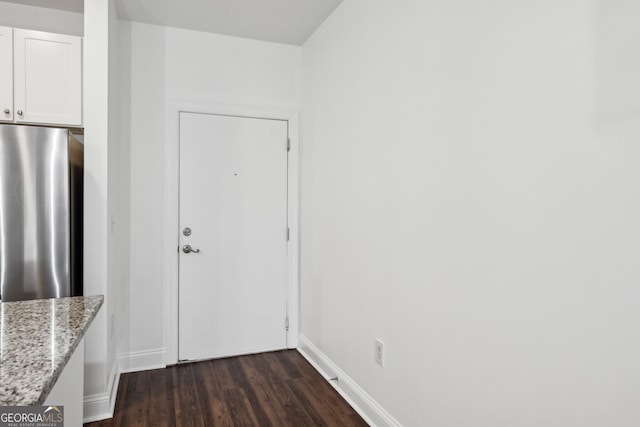 840 United Ave SE Unit 411, Atlanta, GA 30312 - interior space featuring white cabinetry, light stone countertops, dark hardwood / wood-style floors, and stainless steel fridge