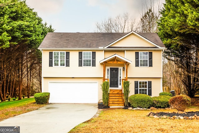 raised ranch featuring a garage