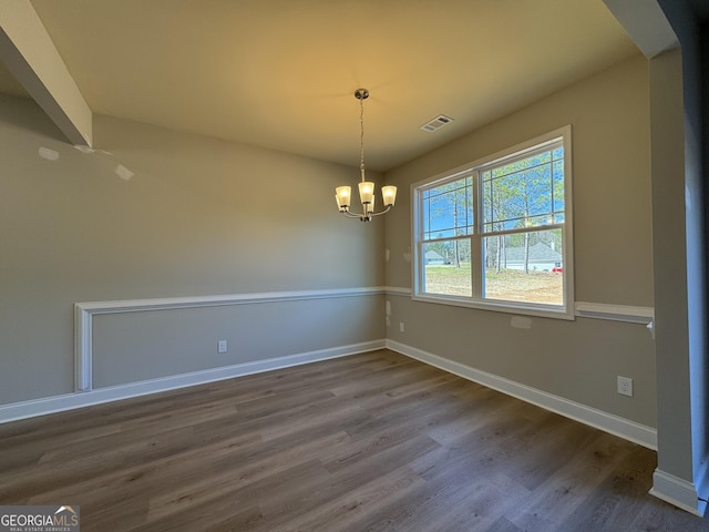 doorway with wood finished floors, a sink, and baseboards