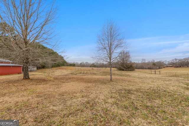 view of yard with a rural view