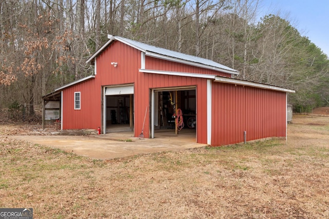 view of pole building with a yard