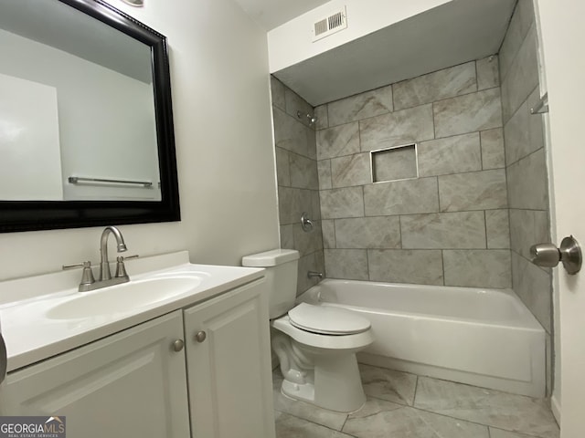 full bathroom featuring vanity, toilet, and tiled shower / bath combo