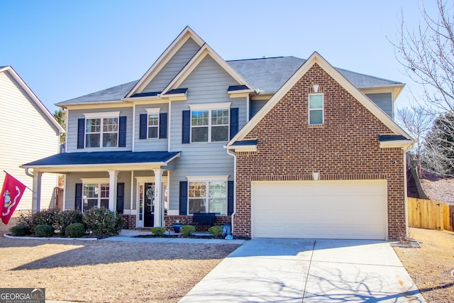 view of front of property with a garage and covered porch