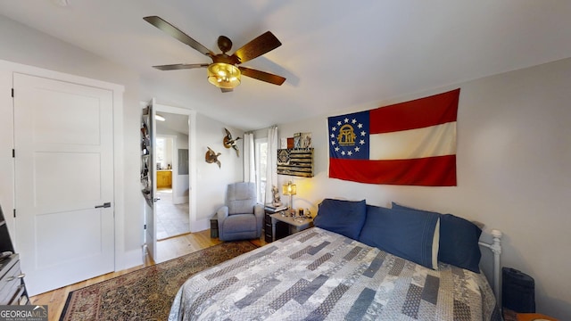 bedroom featuring hardwood / wood-style flooring and ceiling fan