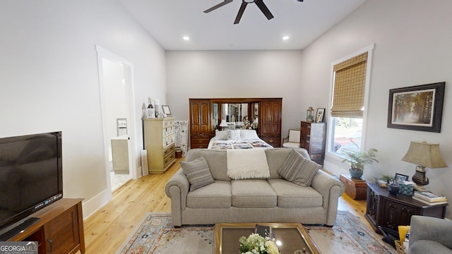 bedroom featuring ensuite bath and light hardwood / wood-style floors