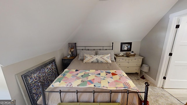 bedroom with lofted ceiling