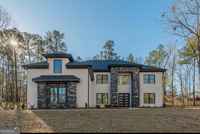 view of front of house featuring brick siding