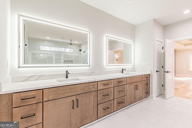 bathroom featuring vanity and tiled shower