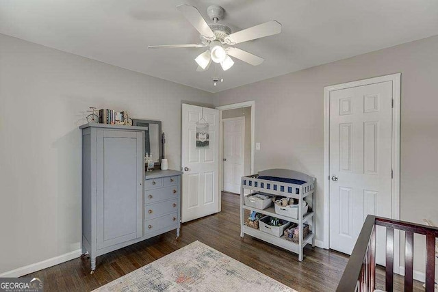 bedroom featuring dark wood-type flooring and ceiling fan