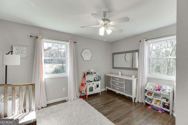 bedroom featuring dark wood-type flooring and ceiling fan