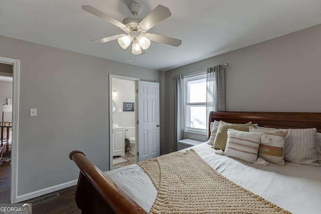 bedroom with dark hardwood / wood-style floors, connected bathroom, and ceiling fan