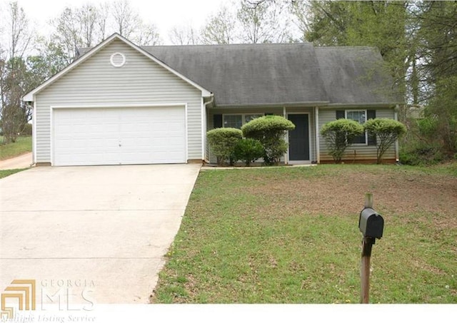 ranch-style home with a garage and a front lawn