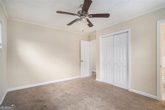 1146 Canal St, Decatur, GA 30032 - unfurnished bedroom featuring ensuite bath, ceiling fan, carpet flooring, ornamental molding, and a closet