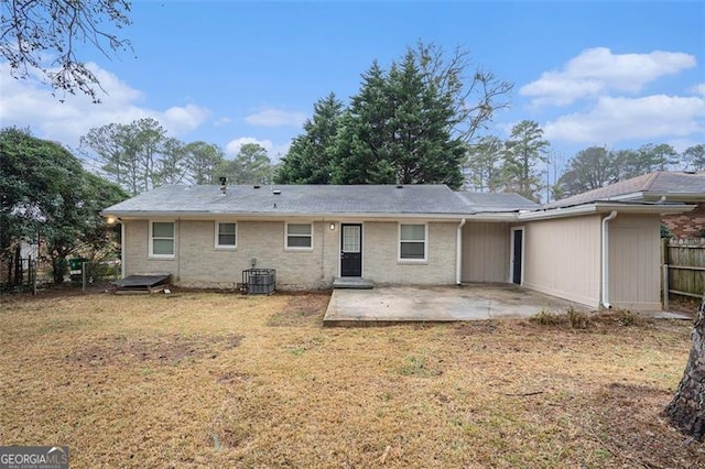 1146 Canal St, Decatur, GA 30032 - rear view of house with central AC, a patio, and a lawn