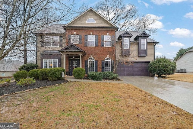 view of front of home featuring a garage and a front lawn