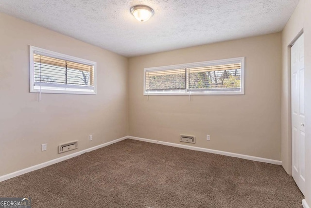 3517 Hyland Dr, Decatur, GA 30032 - empty room with carpet floors and a textured ceiling