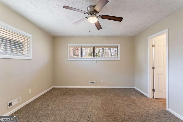 3517 Hyland Dr, Decatur, GA 30032 - carpeted empty room with ceiling fan and a textured ceiling