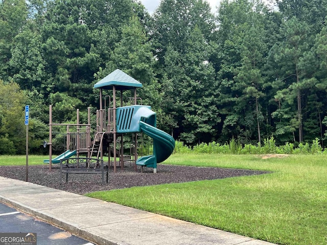 view of play area featuring a lawn